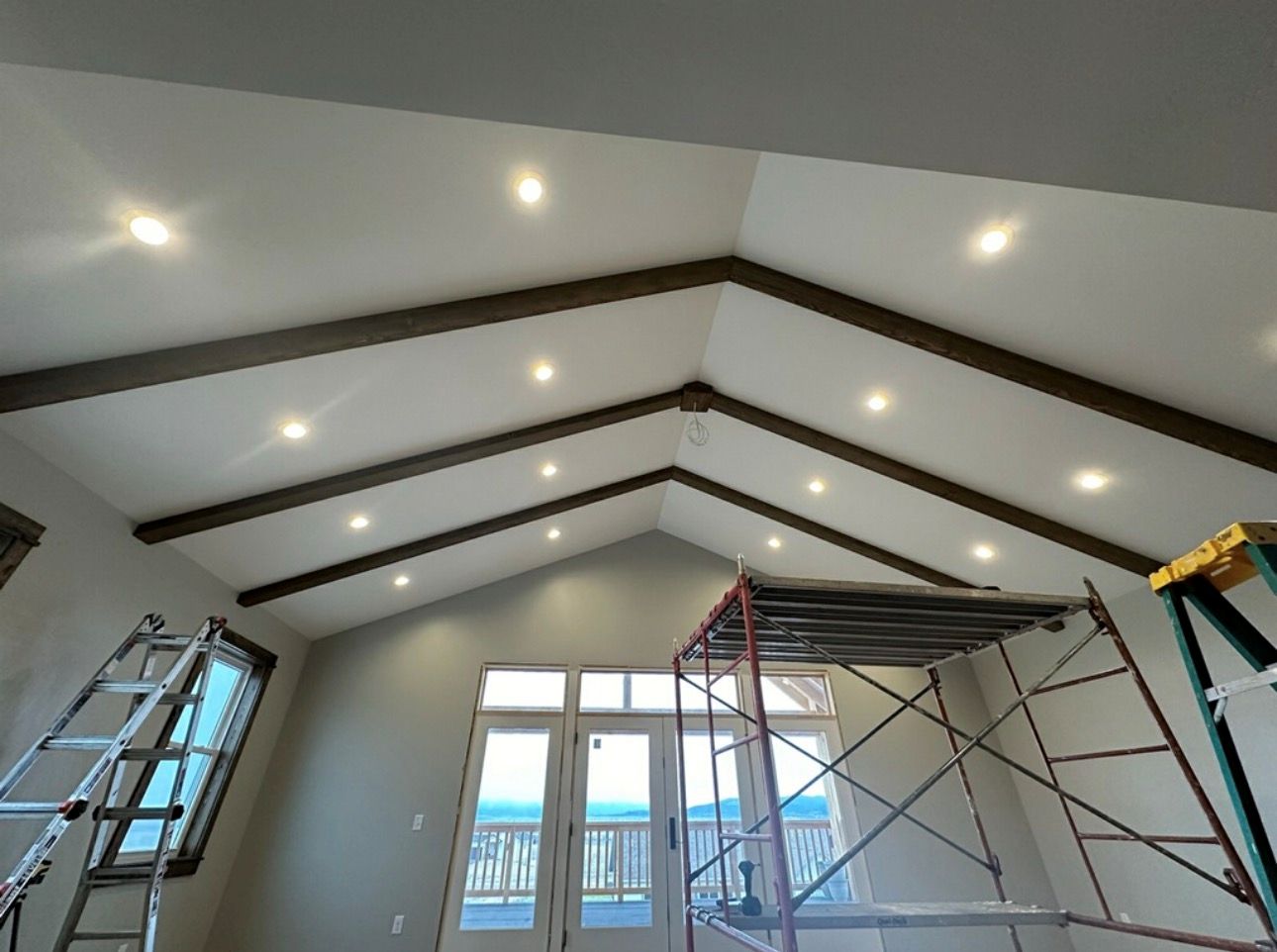 Vaulted ceiling with dark wood beams