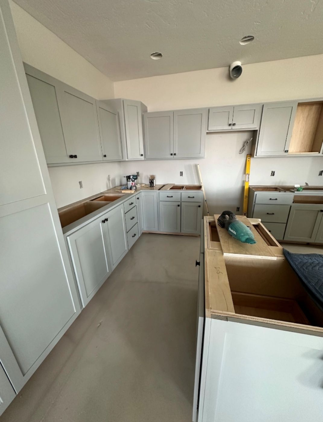 Grey kitchen cabinets going in